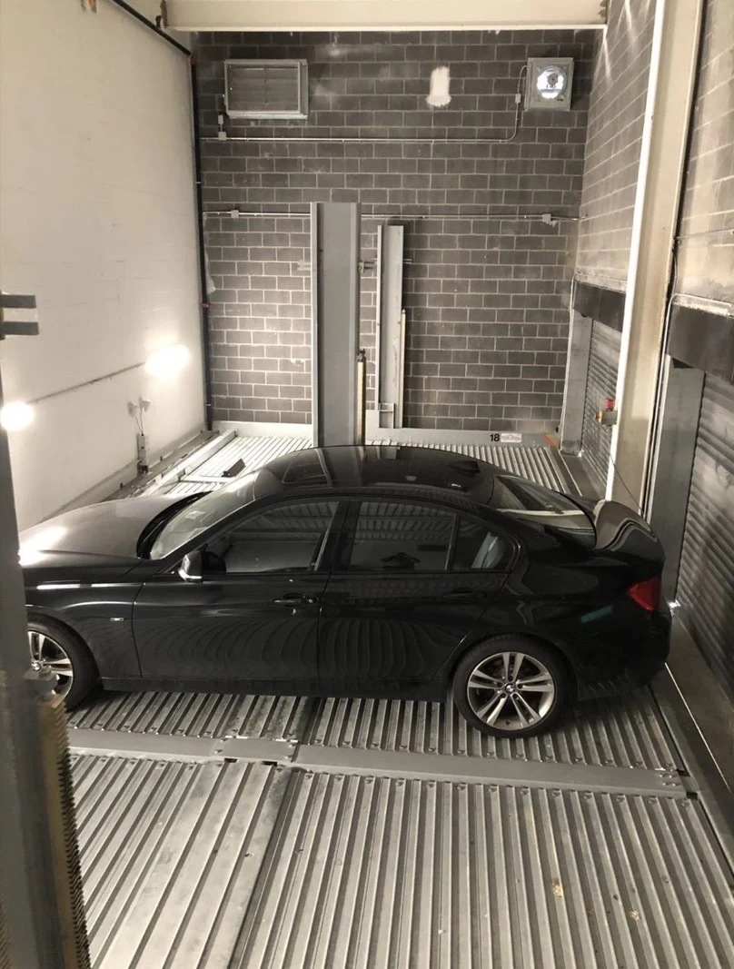 Smaller Foot Print Parking Stacker with Vertical Movement